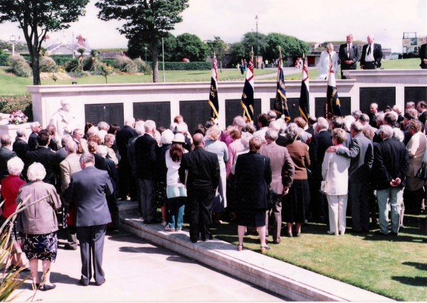Relatives gather at the Naval Memorial on the Hoe